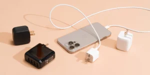 Various mobile chargers including wall chargers, wireless pads, and portable power banks displayed on a white background.